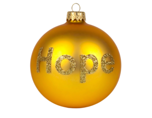 A golden ornament with glittery "Hope" text on it