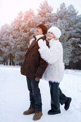 Romantic Partners Explore Icy Woodland Together, Lovers Hand In Hand Wander Through Frosty Forest Landscape In Winter, Two Lovers Enjoy Romantic Walk Beneath Frozen Trees In Snowy Winter Scene