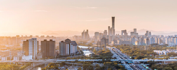 Sunset view of the city skyline near Sihui Bridge in Beijing, China © Govan