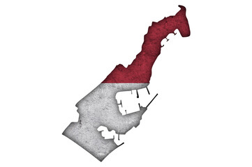 Karte und Fahne von Monaco auf verwittertem Beton