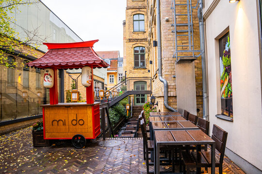 Mobile kiosk Japanese Yatai Mi Do street food cafe. Traditional wooden Japanese roof design and decorated with lanterns with hieroglyphs. Restaurant in Potsdam, Germany - October 26, 2025