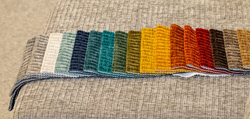 Colorful textile furniture upholstery samples in room interior