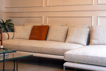 Modern corner sofa interior with soft textile pillows