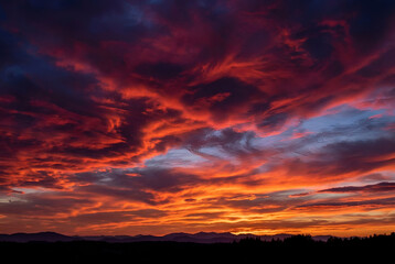 Fototapeta premium Vibrant Sunset with Dramatic Clouds