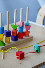 Colorful wooden Montessori stacking toy on table, early childhood education concept