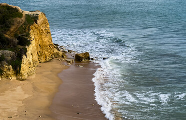 View of the sea and rocks of the beach of Olhos de Agua, Albufeira, Algarve, Portugal.