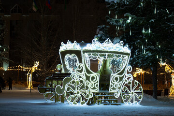 Christmas decorations on the city street at night.