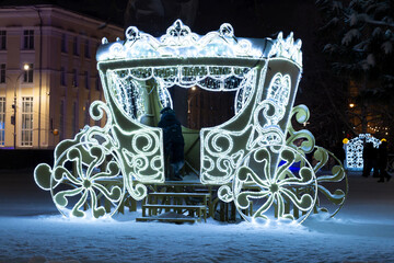 Christmas decorations on the city street at night.