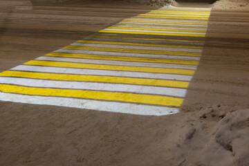 Light projection of a pedestrian crossing at night in the city during winter.