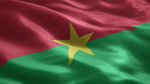 The national flag of Burkina Faso is waving in a seamless loop with a yellow star on red and green