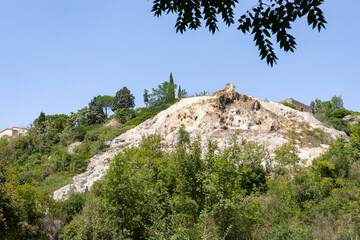 Water mills park (Parco dei Mulini) - people on the hot springs at Bagno Vignoni, municipality of San Quirico d'Orcia, Province of Siena, Tuscany, Italy
