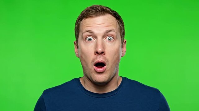 Portrait of a young man, shocking reaction on green screen