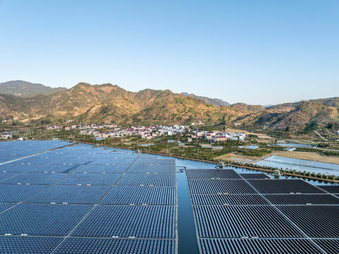 Floating solar farm by mountain lake