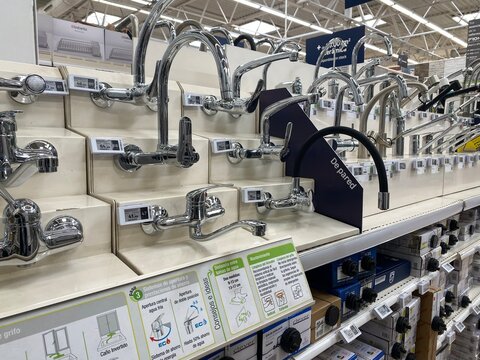 Mallorca, Spain - December 8: Plumbing faucets and shower taps on display at a leroy merlin hardware store, presenting a wide range of options for home renovation and diy projects