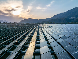 Floating solar farm by mountain lake
