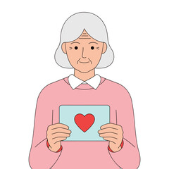 Elderly woman holding a Valentine card with heart symbol  