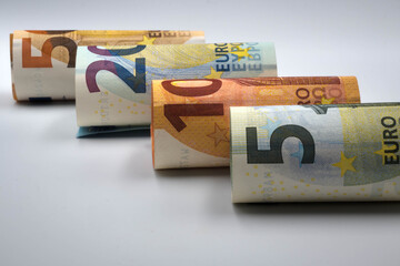Euro banknotes in denominations of five, ten, twenty and fifty.
