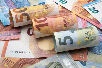 Euro banknotes in denominations of five, ten, twenty and fifty.
