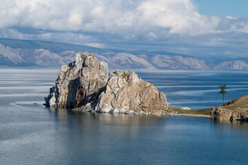 Shamanka rock on the Burkhan cape on a September day. Olkhon island on Baikal lake. Russia
