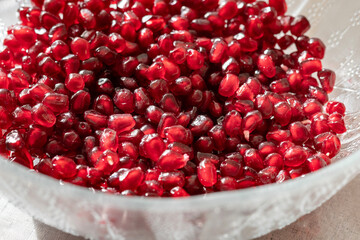 Fresh Pomegranate Seeds in Glass Bowl