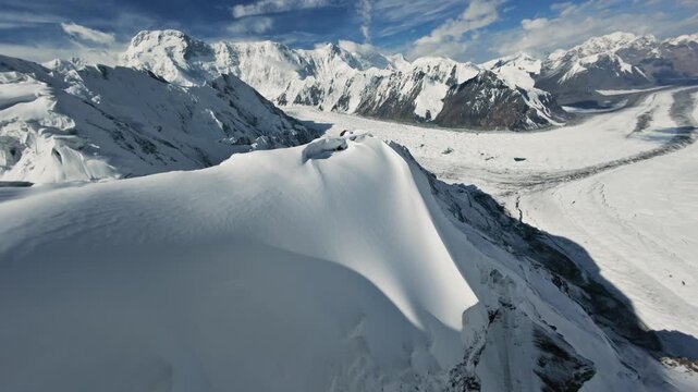 FPV-drone flight over a mountain range. Beautiful landscapes of Kyrgyzstan and the Tien Shan. 4K