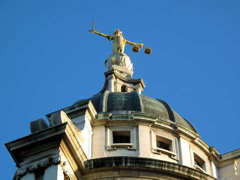 Lady of Justice of the Central Criminal Court fondly known as the Old Bailey in the city of London  England UK, scales of justice stock photo image