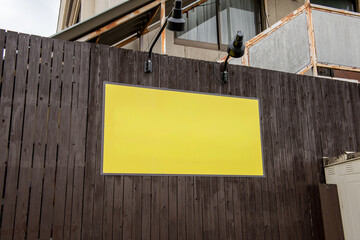 Large blank billboard on a street wall, banners with room to add your own text