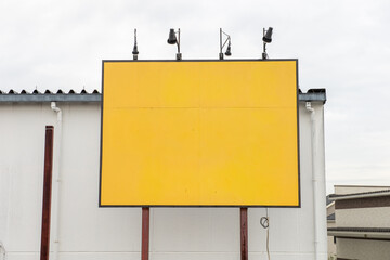 Large blank billboard on a street wall, banners with room to add your own text