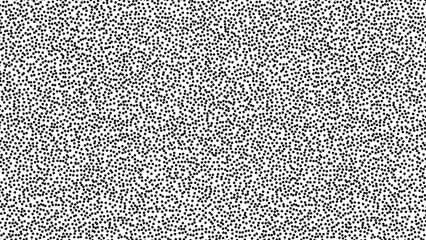 Pointillist pattern with small black dots on white background