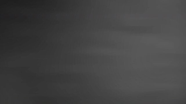 Dark abstract animated background featuring a smooth charcoal and gray gradient with soft flowing motion.