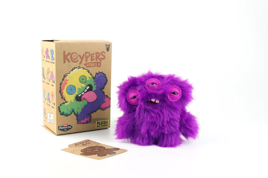 Fuggler funny ugly monster plush toy blind box fur doll , quirky facial expression ugly teeth design, display original packaging on white background collectible Fuggler character known for weird play