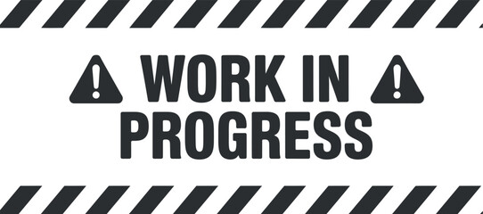 A striking black and white sign declares work in progress with bold lettering and caution symbols