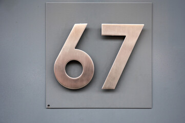 House number 67 with playful pop culture reference
