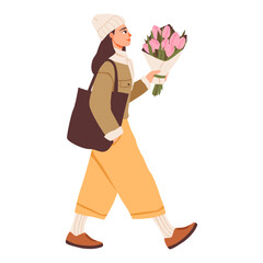Woman Walking with Flower Bouquet in Casual Winter Outfit. Woman walking outdoors holding a bouquet of pink flowers, dressed in cozy  clothing with a tote bag and beanie.
