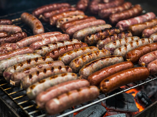 Sausages Grilling Over Hot Coals on a Barbecue food