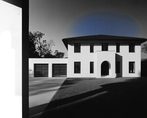 Modern White House With Garage and Blue Sky Halo home