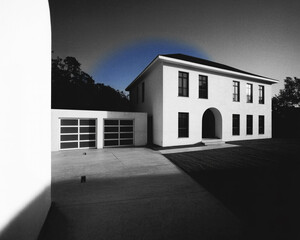 Modern White House With Garage and Blue Sky Halo home