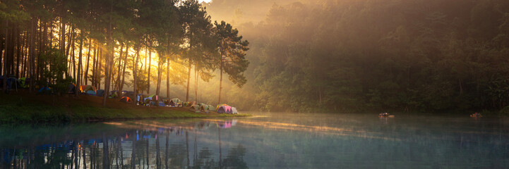 Peaceful Lakeside Camping at Sunrise with Morning Mist and Forest Reflections