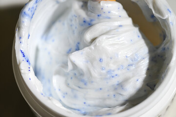 Copper Peptide Powder Being Mixed Into Moisturizing Cream 