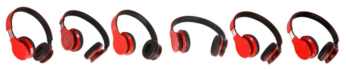 A set of red and black wireless surround headphones on an isolated background