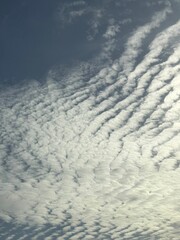 Wavelengths of light sculpted by atmospheric currents creating a textured aerial vista