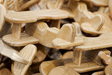 A lot of small toy wooden airplanes