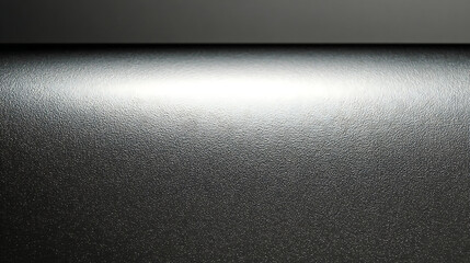 Textured Dark Gray Surface with Subtle Lighting Gradient