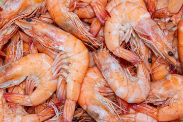 Orange cooked shrimp and prawns filling the frame, creating a delectable background for food, healthy eating, and recipes