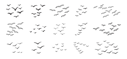 Obraz premium Birds flying line in the sky set. Ink grunge flock of birds afar brush hand drawn. markers and crayons