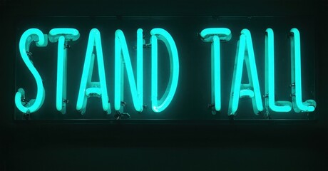 Obraz premium Bright turquoise neon sign displays words stand tall. Dark background emphasizes glowing text. Simple, motivational message.