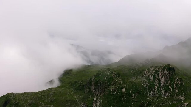 Cinematic Aerial View of Dense Fog Shrouding Jagged Rck Formations