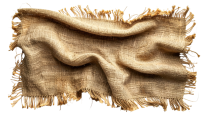 A close-up of a roughly-textured, beige burlap cloth with fringed edges, dramatically lit