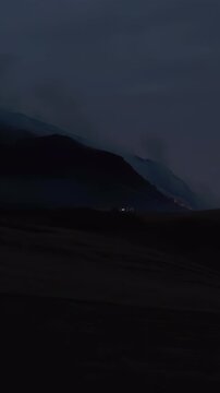 EDINBURGH, SCOTLAND, UK - AUGUST 10, 2025: Fire is visible on Arthur's Seat in Edinburgh during the evening hours, smoke is rising from the hill.