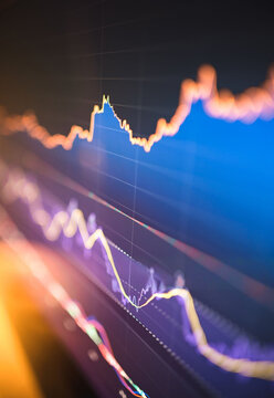 Abstract financial chart with upward and downward trends on a digital screen